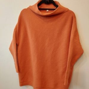 Orange oversized mock neck sweater